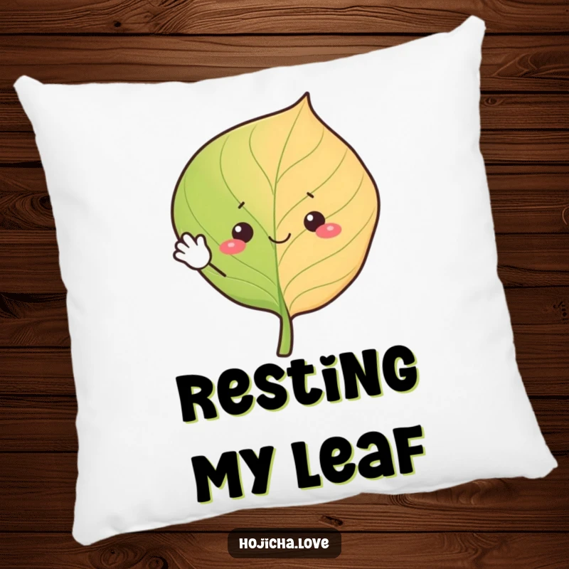 Funny hojicha leaf pillow, cheerfully waving with simple eyes, soft and cozy comfort with a friendly design.